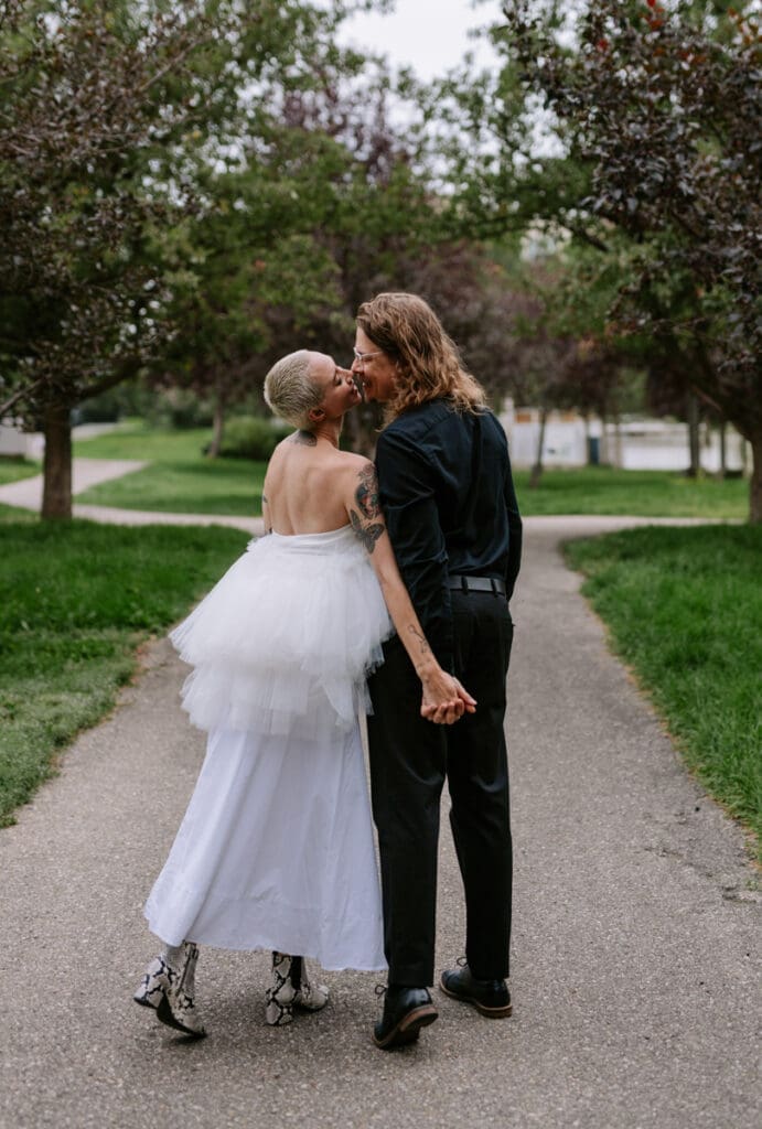 A couple walks in a park in downtown Calgary.